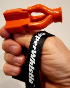 The Hyper whistle was created to meet the demand of the US Navy, and it is considered the loudest whistle in the world. It is an orange object with a black lanyard.
